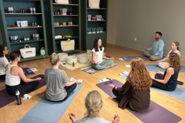 people sitting on the floor in meditation class